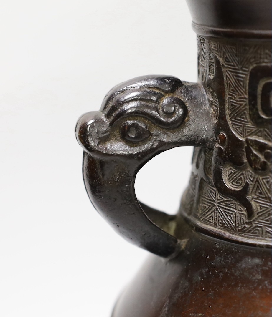 A Chinese archaistic bronze double handled 'hu' vase, 19th century, 27.5cm high